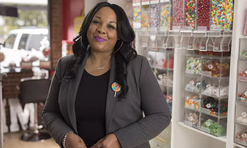 Felicia Evans Long poses for a shot in her candy store