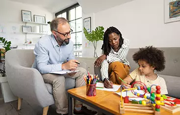 A case manager works with a mother and her young child