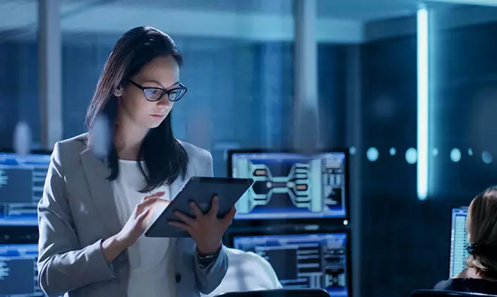 Data manager works in a room filled with computer equipment