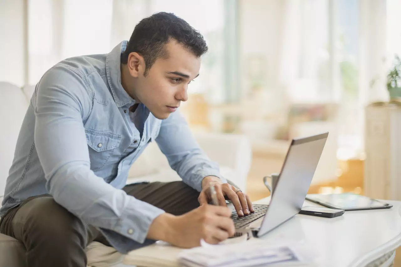 Man working on a laptop to signify careers in digital marketing