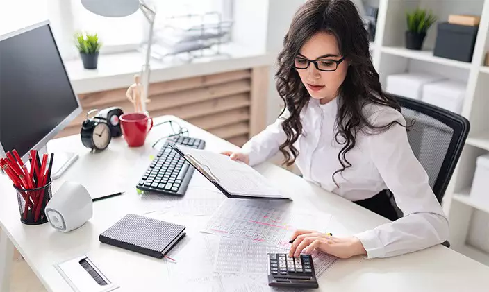 Accountant using a calculator