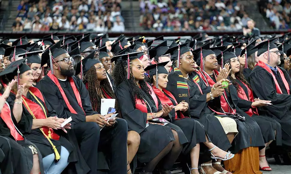 Graduates seated together at the 2026 Spring Commencement ceremony in Phoenix.