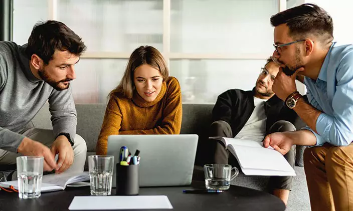 A teacher-leader collaborates with fellow faculty