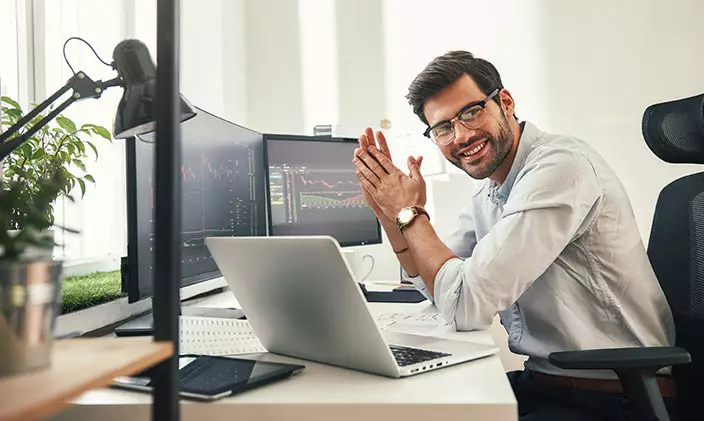 Smiling male information technology professional who got an online IT degree