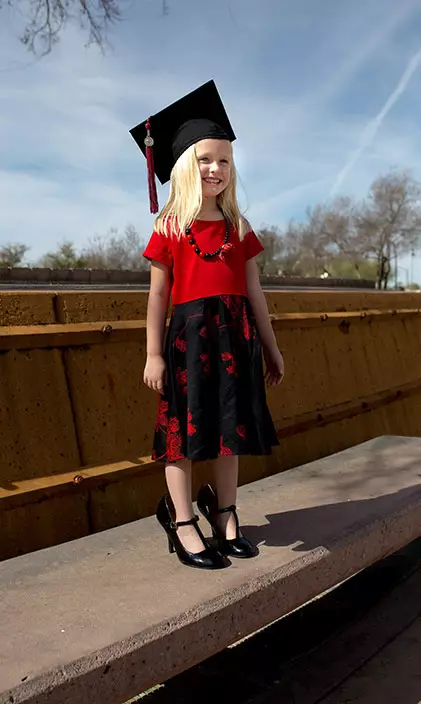 Jex's daughter tries on mom's mortar board