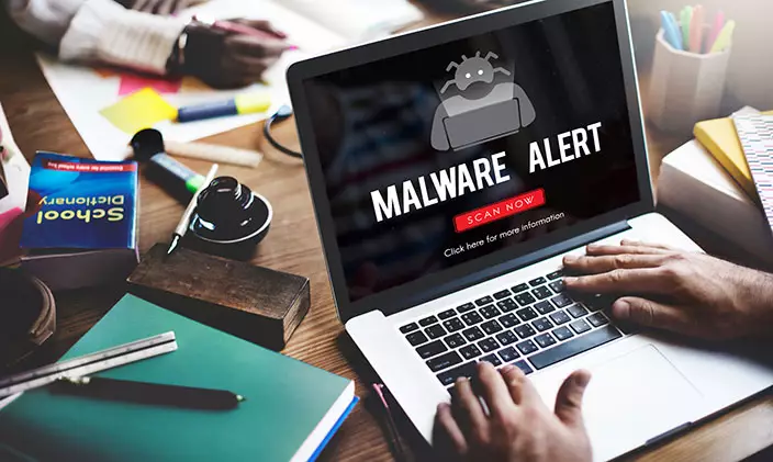 Laptop with a malware alert screen