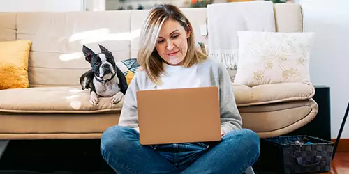 A woman taking an online course at home