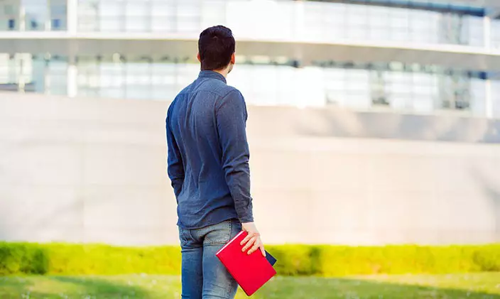 Man pondering future and online degrees