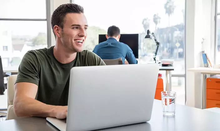 Military veteran taking online classes on a laptop