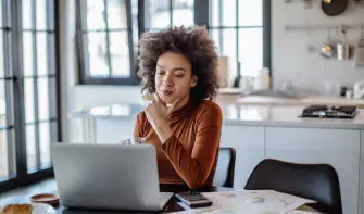An M P H student does online research in her concentration courses
