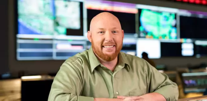 IT professional sits at his workstation of his new job. 