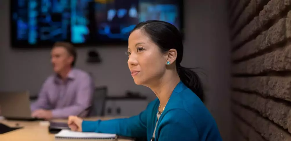IT professionals attend IT conference in a meeting room.