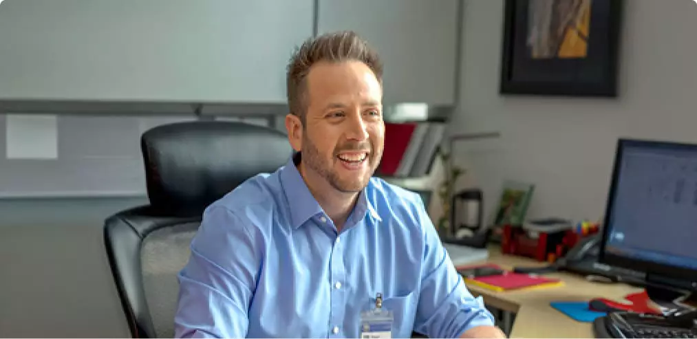 College student takes class online from home office