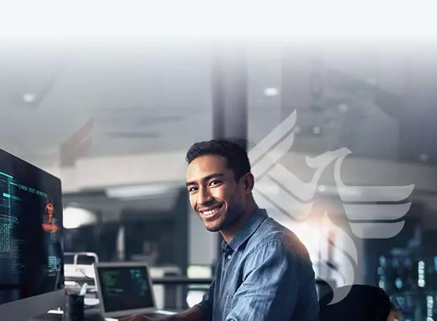 IT professional works at his computer. 