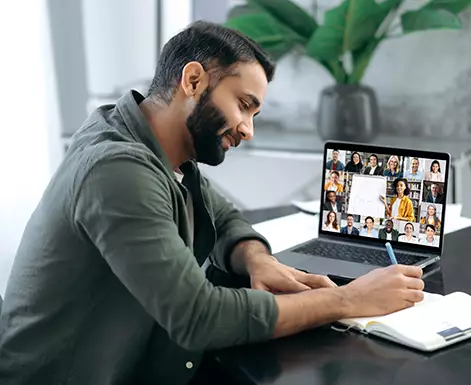 Employee taking notes during a meeting