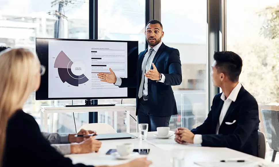 Businessman giving a speech on business operational data during work meeting