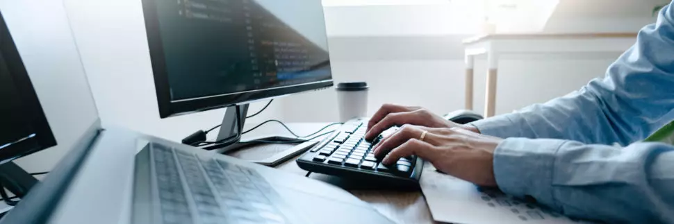Cybersecurity expert working on a computer