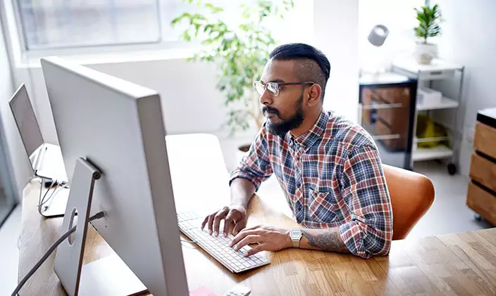 Student attending online class in a comfortable study space