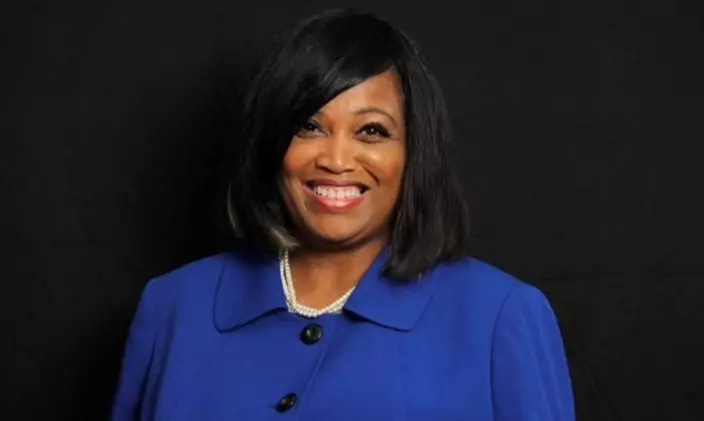 Professional headshot of Tammie Otukwu in a buttoned-up blue jacket