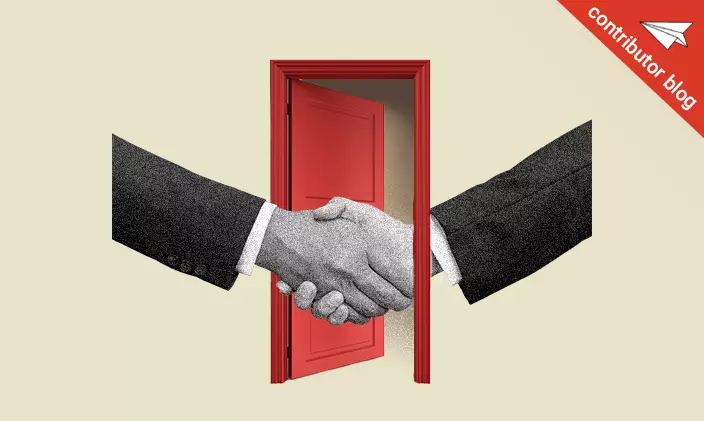 Two hands shaking through a door as an employee resigns from a job