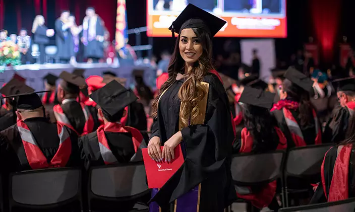 University of Phoenix grad holds a diploma