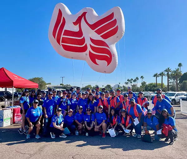 Ƶ employees gather at the 2025 Phoenix Veterans' Day Parade.