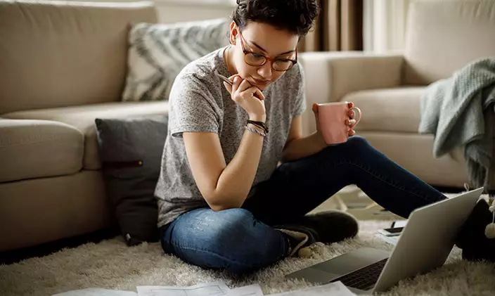 Female student taking an online class at home